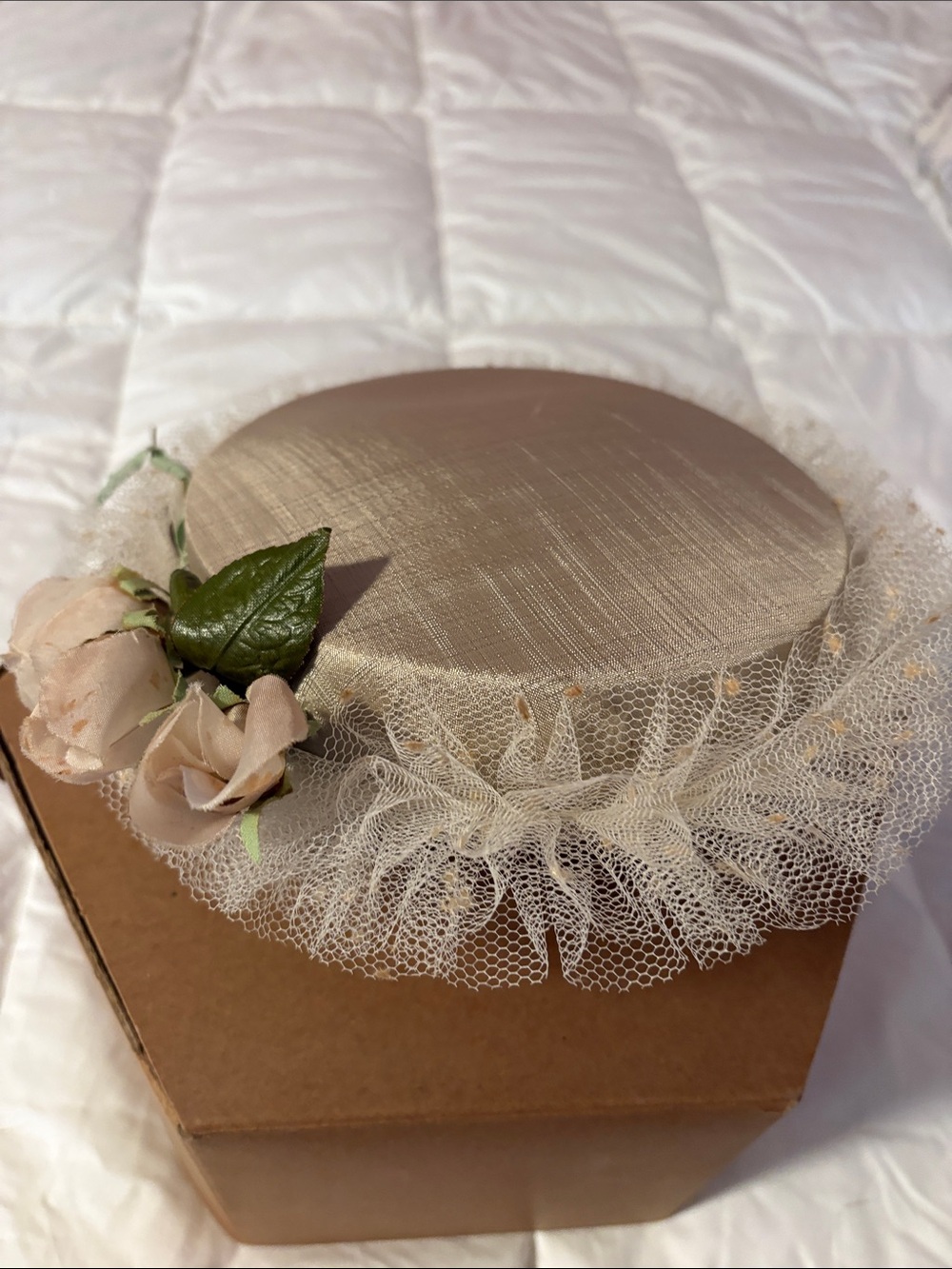 Vintage-inspired Cream Pillbox Hat with Tulle and Floral Accent